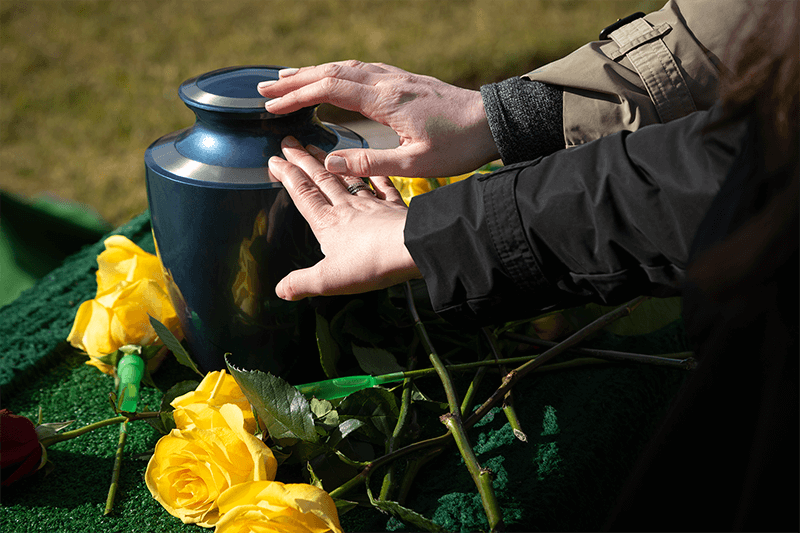 Ash/urn deposition to a burial ground